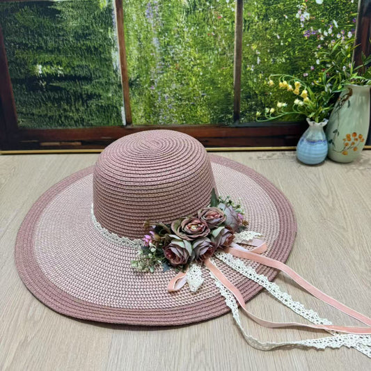 Blush pink wide-brim sun hat with pink roses, greenery, and lace satin ribbons