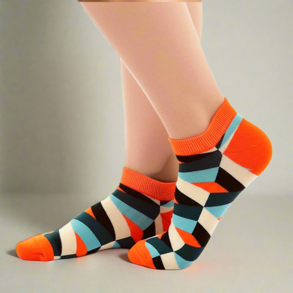 Colorful geometric-patterned socks on a white background