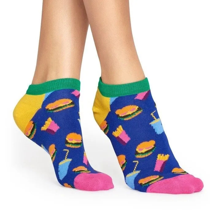 Colorful socks with fast food patterns worn by a person on a white background