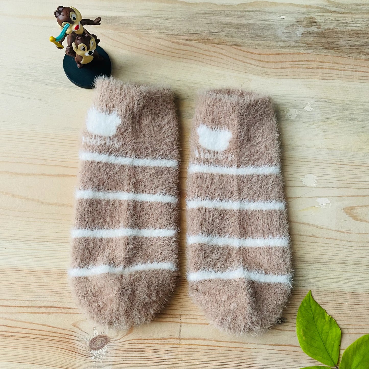 Top view of the beige and white striped unisex winter ankle socks.