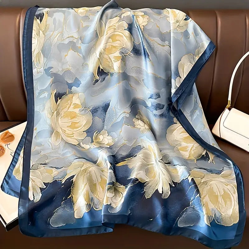 Elevate your style with this luxurious silk-feel satin scarf featuring a beautiful blue and white watercolor floral design. Measuring 90 x 180 cm, it’s perfect for evening wear or as an artistic gift.
