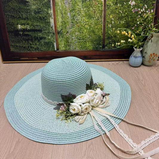 Mint green wide-brim sun hat with white roses, lace ribbons, and vintage floral detailing