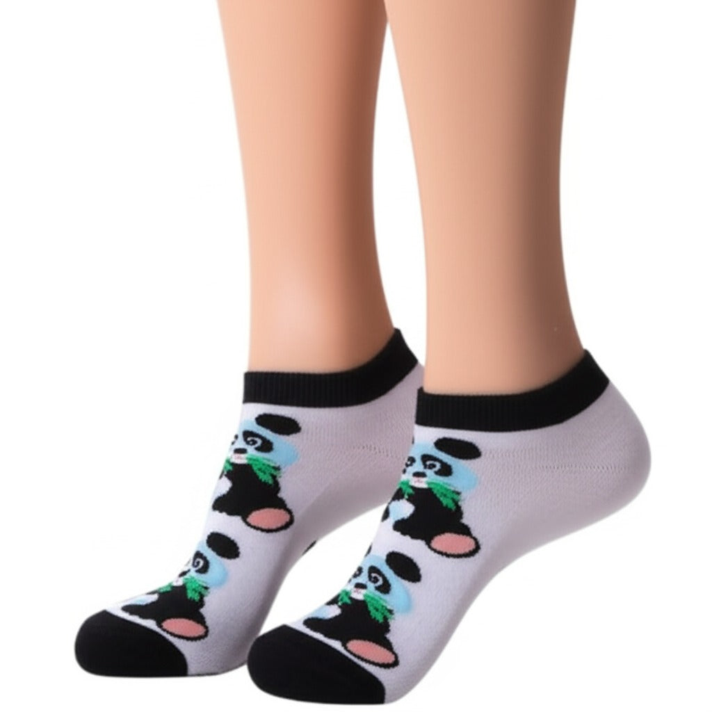 White socks with panda design worn by a person on a white background