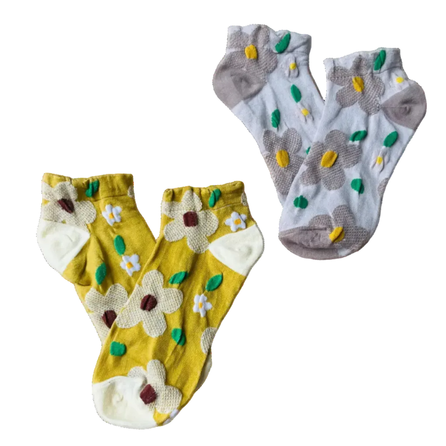 Two pairs of socks, one yellow with floral designs and the other gray with green accents, on a white background.