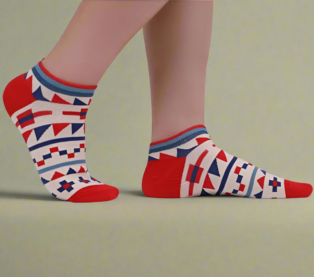 Colorful geometric-patterned socks on a plain background