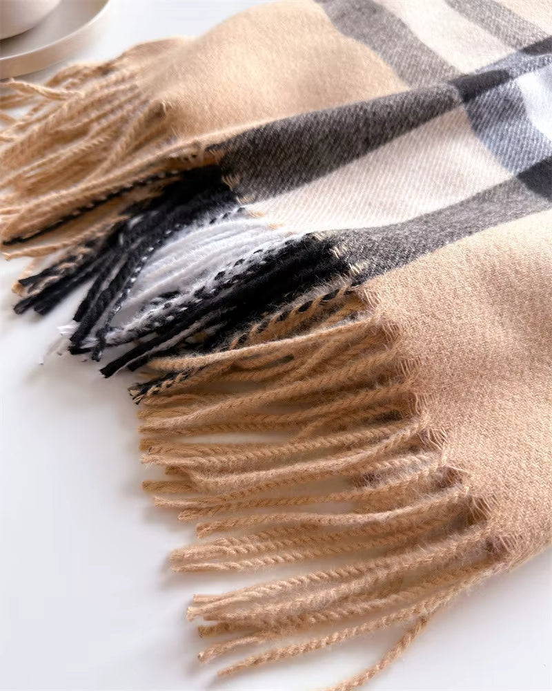 Plaid scarf with fringes on a white background