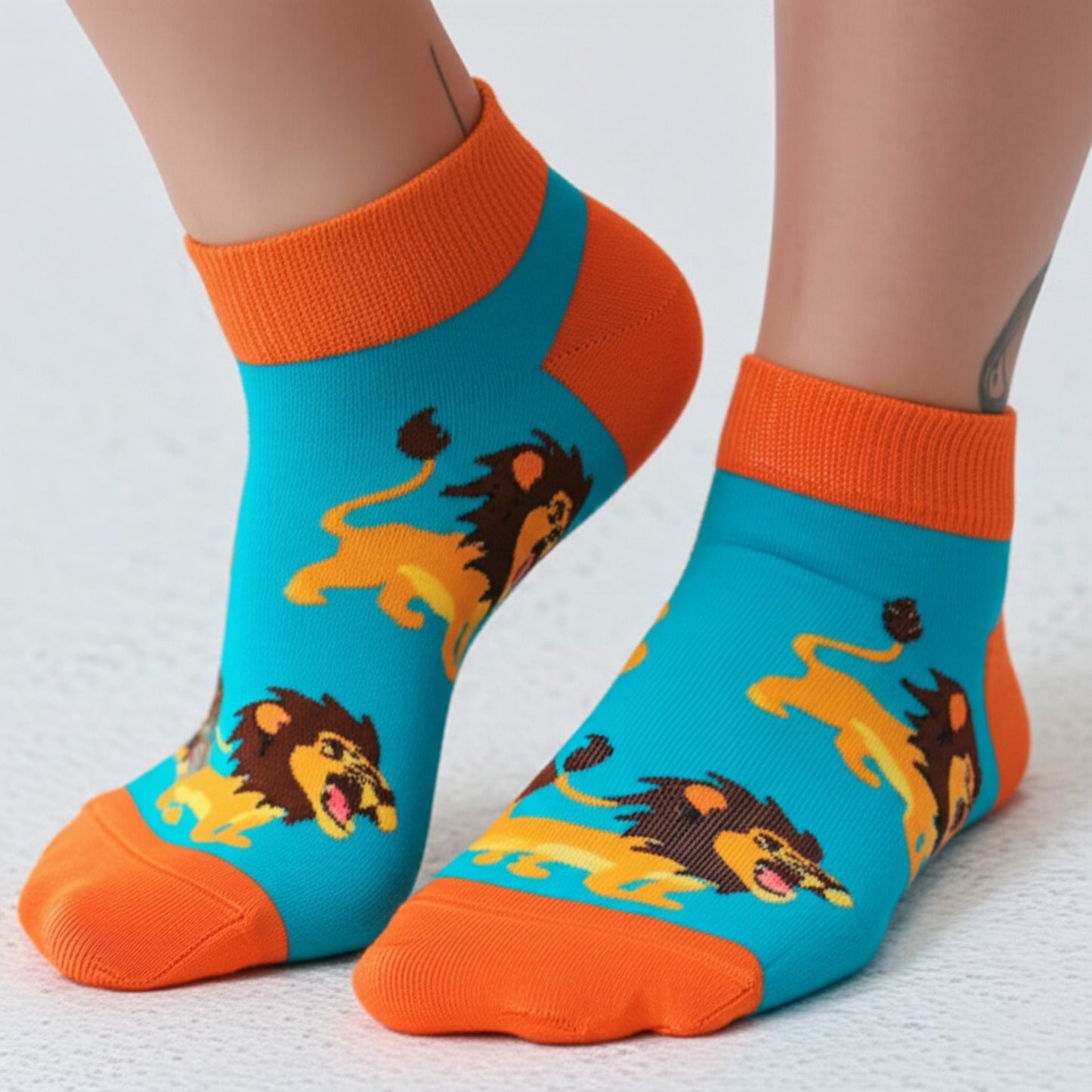 Colorful socks with lion designs on a white background