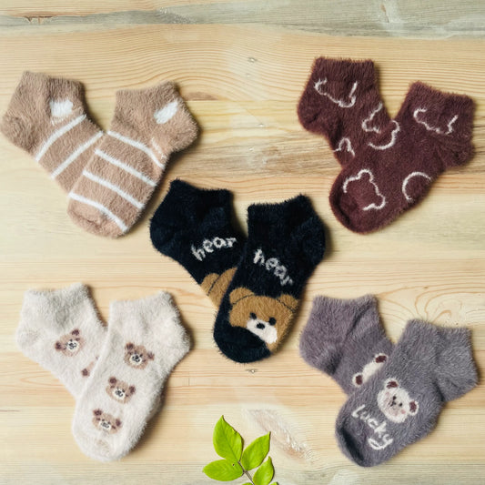 Pack of 5 unisex fuzzy mink winter socks in different colors and cute bear designs, available online in India.