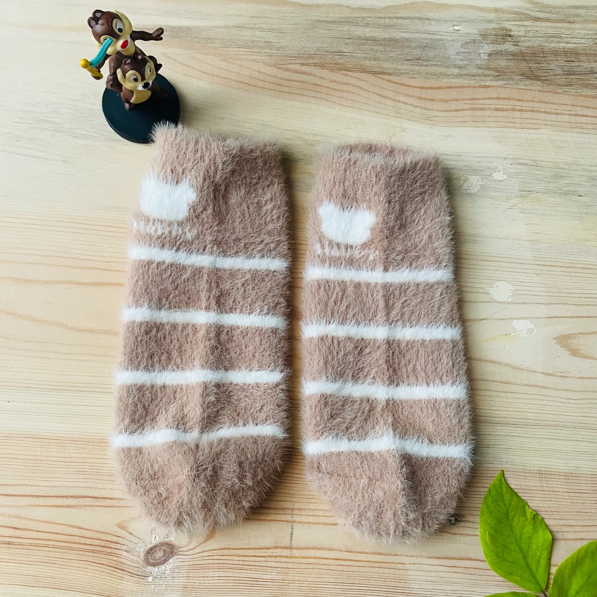 Top view of the beige and white striped unisex winter ankle socks.