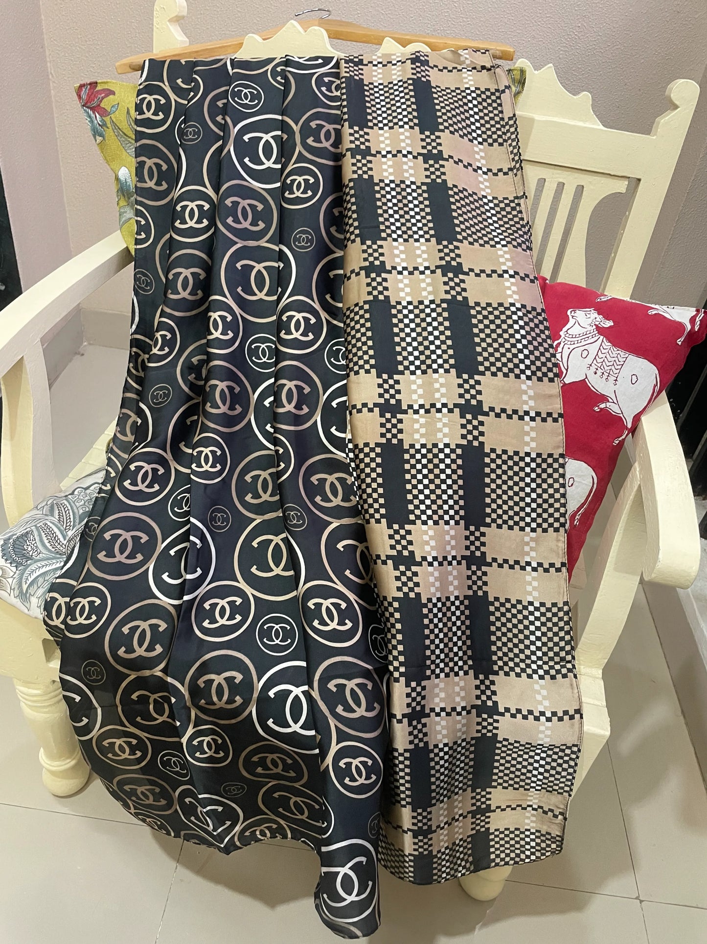 Discover ultimate versatility with this luxurious silk-feel satin scarf. Featuring a unique dual pattern of a chic beige & black check and a classic monogram, this 90 x 180 cm scarf offers multiple styling options.