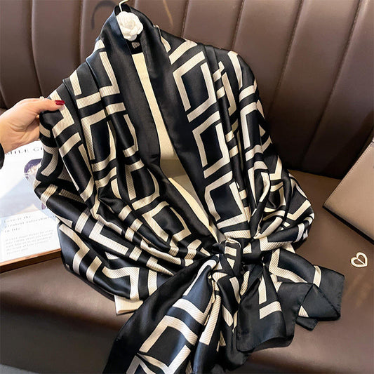 Elevate your style with this luxurious silk-feel satin scarf in bold black and white geometric pattern. Measuring 90 x 180 cm, it’s perfect for evening wear, travel, or as a sophisticated gift.
