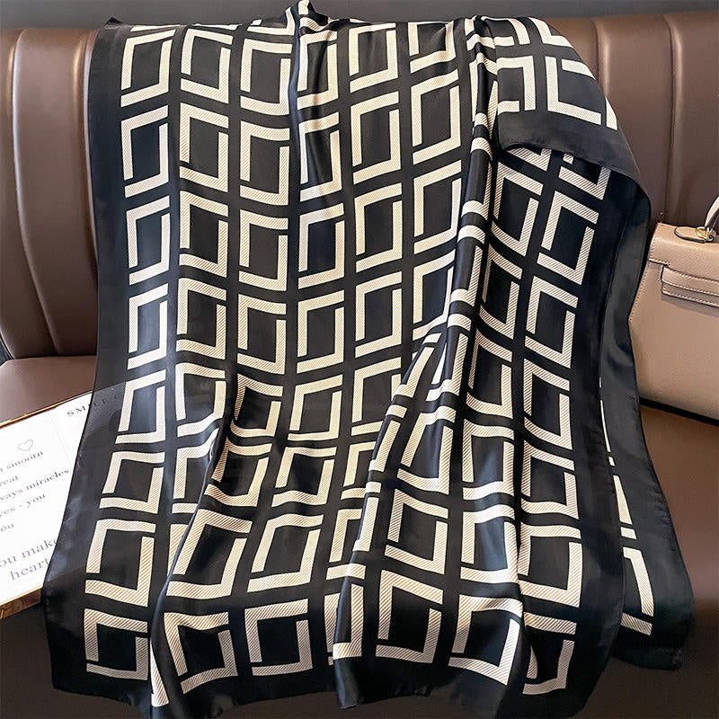 Elevate your style with this luxurious silk-feel satin scarf in bold black and white geometric pattern. Measuring 90 x 180 cm, it’s perfect for evening wear, travel, or as a sophisticated gift.

