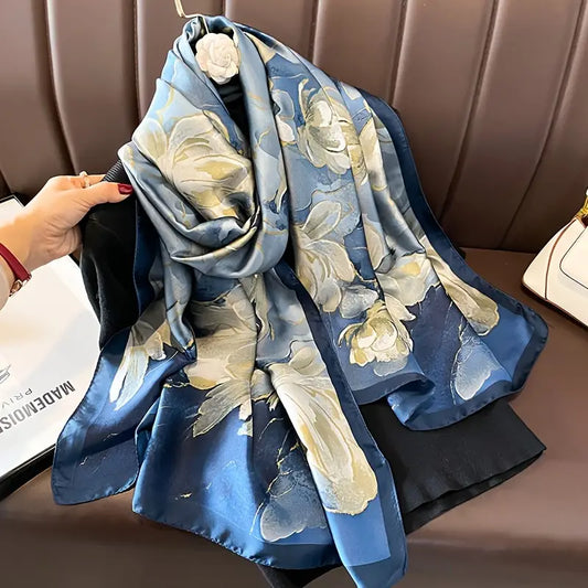 Elevate your style with this luxurious silk-feel satin scarf featuring a beautiful blue and white watercolor floral design. Measuring 90 x 180 cm, it’s perfect for evening wear or as an artistic gift.
