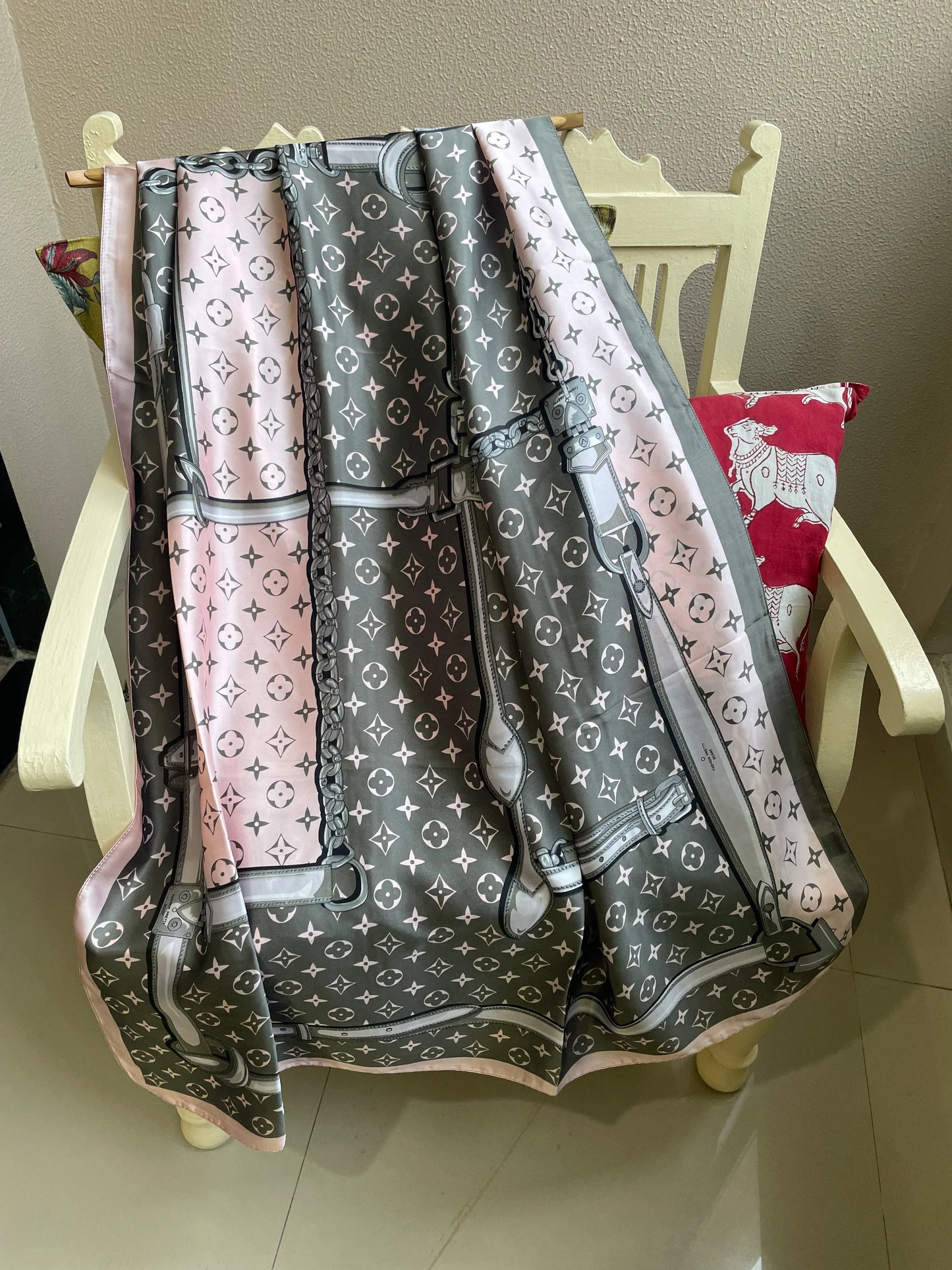 "Elegant pink, grey, and white designer satin scarf draped over a chair – monogram print"

