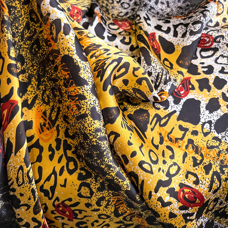 Make a bold statement with this luxurious silk-feel satin scarf featuring a vibrant yellow and black abstract animal print with red accents. Measures 90 x 180 cm. Perfect for elevating your style.
