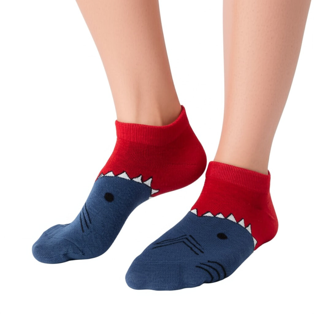 Shark-themed socks with red tops and blue bodies on a white background