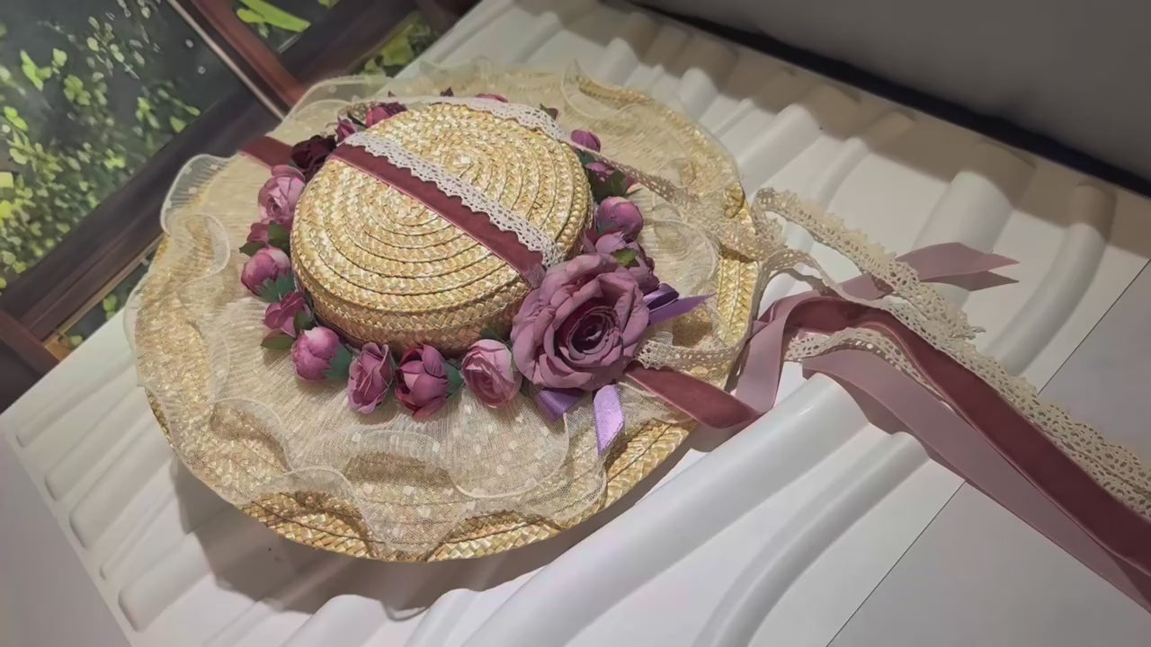 Discover the Amelia, a vintage-inspired straw hat with dusty mauve roses, a lace brim, and velvet ribbons. Perfect for Victorian events, photoshoots, and romantic occasions.